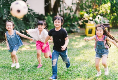 stock-photo-asian-and-mixed-race-happy-young-kids-running-playing-football-together-in-garden-multi-ethnic-1329209570